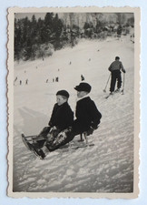 Two boys on a sledge, snow mountain ski - old photo snapshot