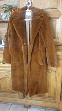 beau manteau en fausse fourrure couleur roux taille 38. Très doux et chaud