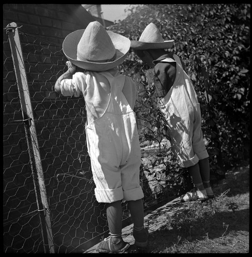 Kids hat overalls fence