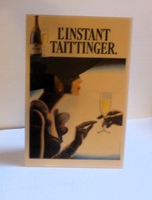 L’INSTANT TAITTINGER CHAMPAGNE ADVERTISING POSTER’ STAND cm. 40 x 26 70s