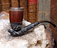 pipe with carved pipe and heather fireplace