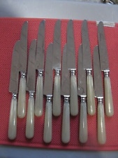 ++"521.2" 12 VINTAGE TABLE KNIVES STAINLESS STEEL BLADE PLASTIC HANDLE BRAND S.T.