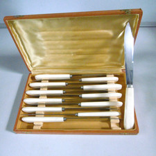 12 knives blades stainless steel cream handles