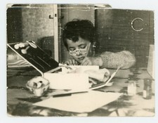 PHOTO snapshot, boy white glasses drawing material