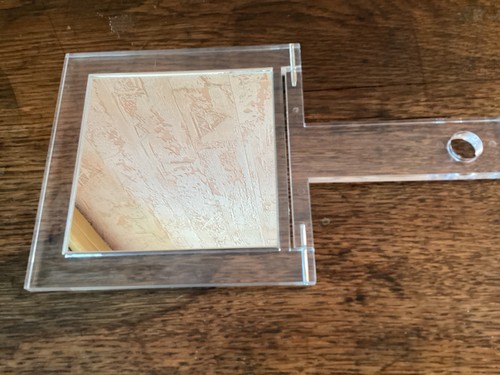 Miroir avec face grossissante