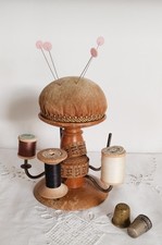 Pique aiguilles et bobines en