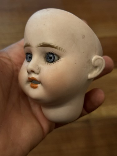 Tête poupée porcelaine - de,