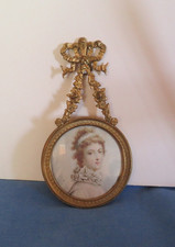 old bronze round photo frame hanging, flower garland decor