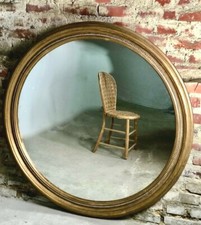 Miroir en bois doré patiné