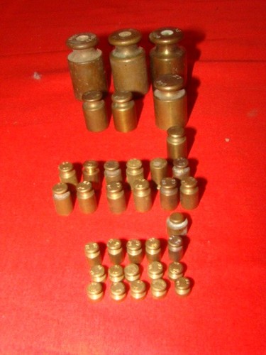 Lot poids en laiton - de,