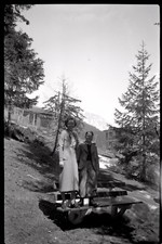 Young woman & boy standing on bench - old photo negative year. 1930