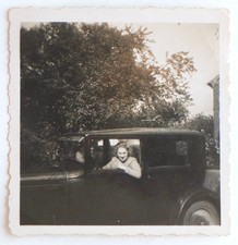 Woman steering car window - old photo snapshot