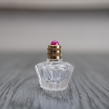 Empty Miniature, Star Shape Glass Bottle Decorated with a Pearl