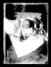 T054 Big baby in a crib. Doll, 1900. negative glass photo. 