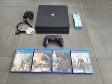 Console PS4 Pro 1 To + 4 jeux