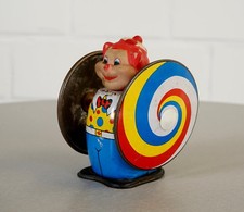 Jouet en tôle à ressort remontable psychédélique litographié vintage années 50