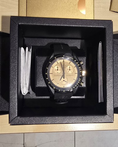Swatch omega mission the - x,