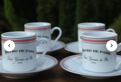 Set demitasse cups with - of,