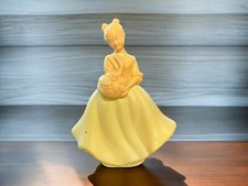 Avon women's eau de cologne perfume bottle in yellow dress with flower basket