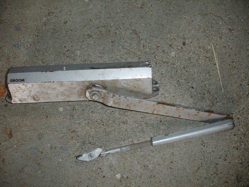 Ferme porte hydraulique bras