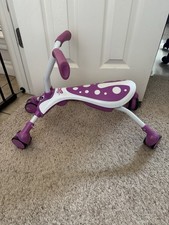 Slightly used purple scramble bag folding bike ride on toy trike bicycle kids on