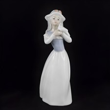 Figurine femme en porcelaine