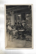 Untitled photo card showing 3 men drinking aperitif on the terrace.