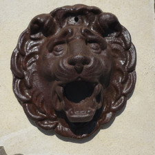 Mascaron en fonte en forme de