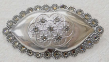 REMINISCENCE Made in France silver tone brooch set with glass, signed.
