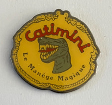 11 - Pin's DINOSAURE - CATIMINI LE MANEGE MAGIQUE