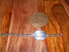 Médaille bronze et plaque
