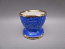 Coquetier ancien en porcelaine