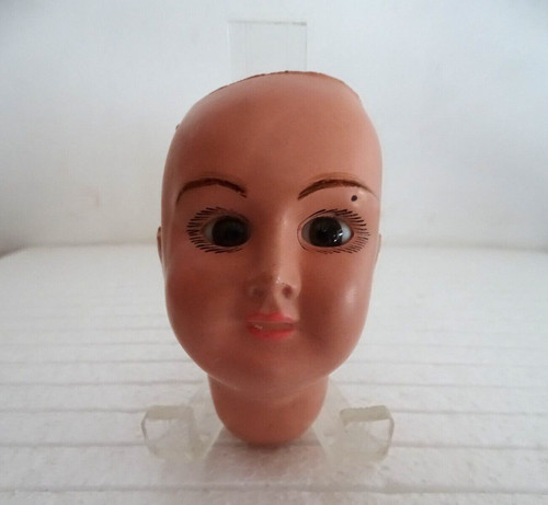 Tête poupée ancienne