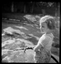 Little Girl with Water Hose - Antique Photo Negative Year. 1940