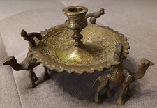 ANTIQUE ORIENTAL BRASS CANDLE HOLDER WITH CAMELS AND HANDCRAFTED ENGRAVINGS