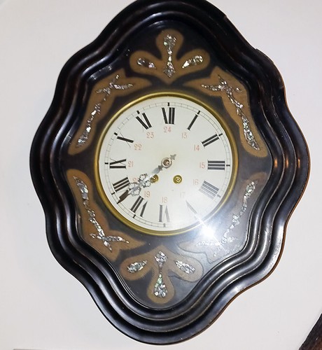 Horloge oeil boeuf avec - de,