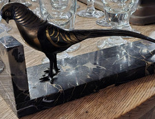 Serre livre, fessant en bronze