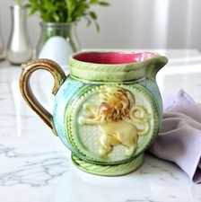 Onnaing. Slipper pitcher polychrome decor lion model, early 20th century