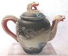 Asian teapot with embossed pattern.........2570