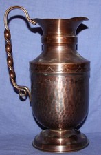 Cruche vintage en cuivre fait
