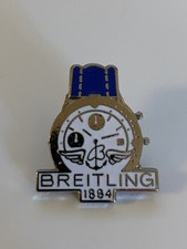 PIN'S MONTRE BREITLING ARGENT