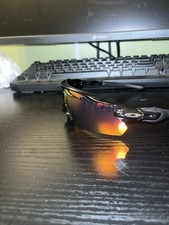 Oakley Sun Glasses Black Frame And Orange Lense With No Scratches