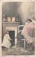 CP CHRISTMAS LITTLE GIRL NEAR FIREPLACE BABY CRADLE - 62524