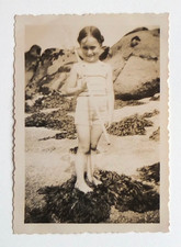 Girl fishing shrimp rocks kelp