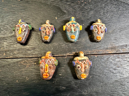 Pendentif amulette visage