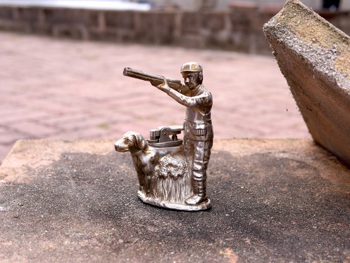 Hunter and dog - and, figural