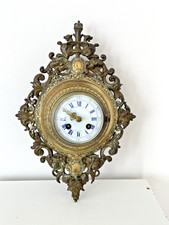 Pendule  cartel en bronze .