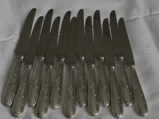 Lot de 12 couteaux manche métal argenté lame inox.