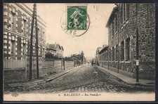 CPA Malakoff, Rue Paul-Bert avec bâtiments en pierre et pavés 1914 