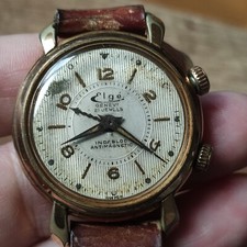 montre homme  Alarme Réveil  mouvement mécanique plaqué or Elgé alarm clock